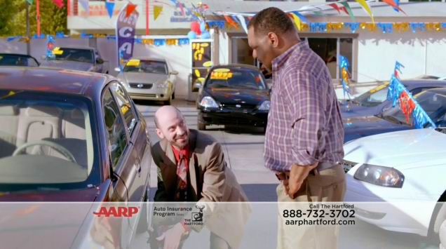 Actor Jeff Blumberg playing a used car salesman in a TV commercial