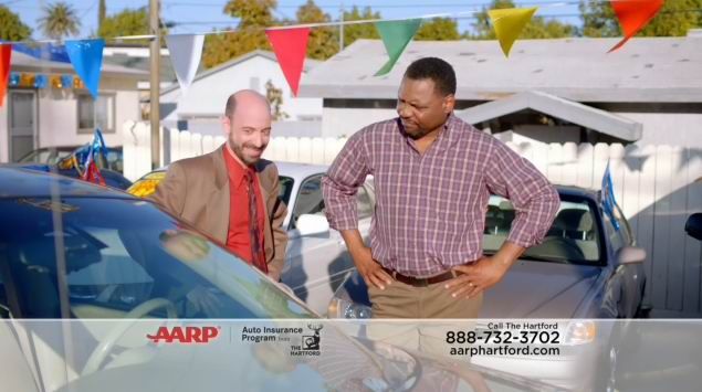 Actor Jeff Blumberg playing a used car salesman in a TV commercial